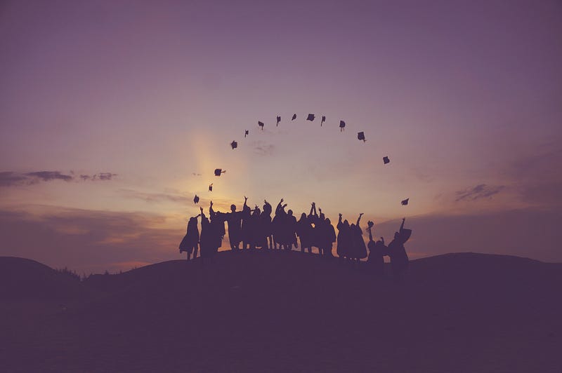 Graduation cap toss celebration.