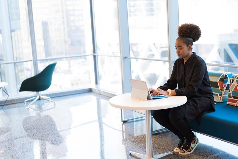 A woman in tech enjoying a collaborative workspace