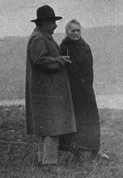 Einstein and Curie discussing science in 1929